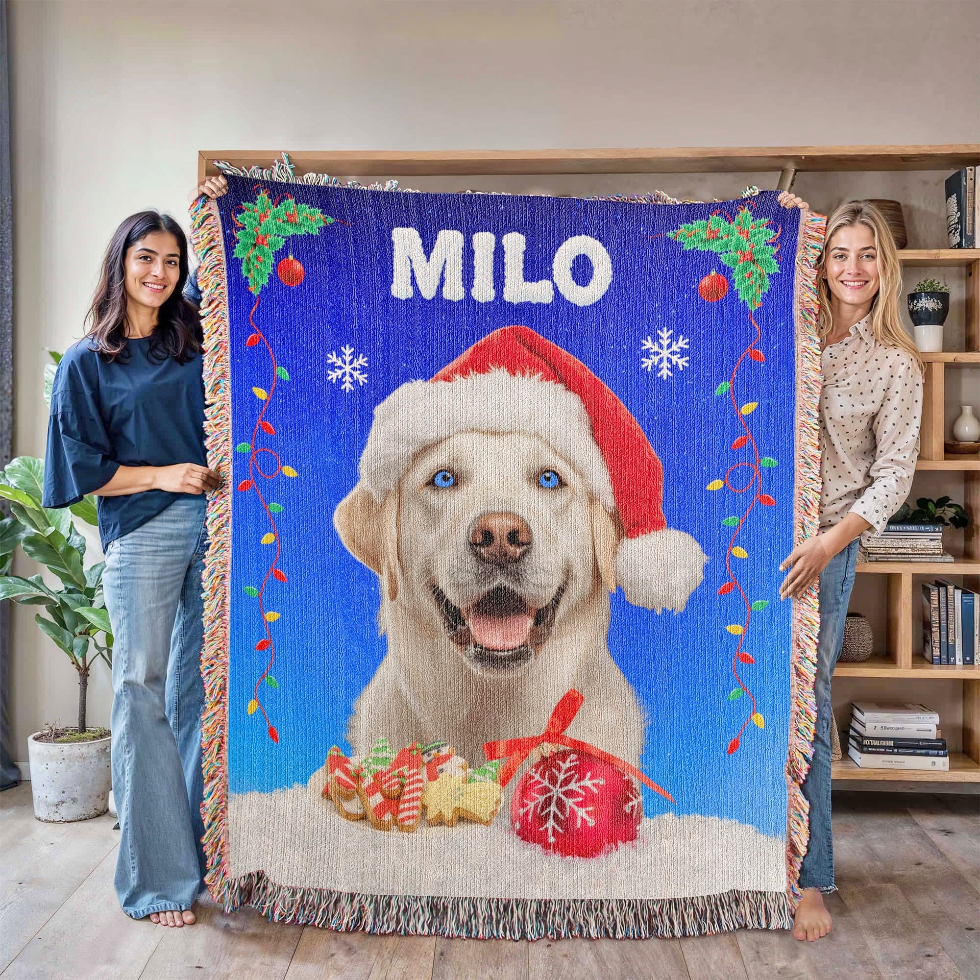 Two people holding a blanket with a dog wearing a Santa hat and the name 'Milo'.