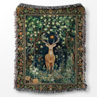Decorative throw blanket with a deer in a forest design on a white background