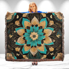 Woman holding a decorative blanket with floral patterns on a white background