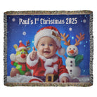 Blanket with a baby in a Santa outfit and reindeer, snowman, and text 'Paul's 1st Christmas 2025' on a blue snowy background.