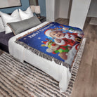 Decorative blanket with a Christmas design on a bed in a bedroom setting